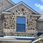 After Repair has been completed - all the bricks and stones are replaced and reset with a lighter weight faux stone material and properly supported.