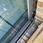 The Stones and bricks are too heavy, and not properly supported creating a sag and buckle which has made it pull away from the house.
